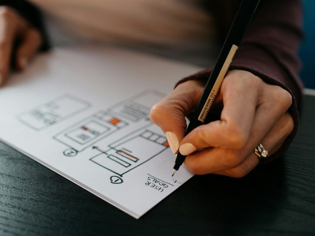 Designer sketching a website wireframe