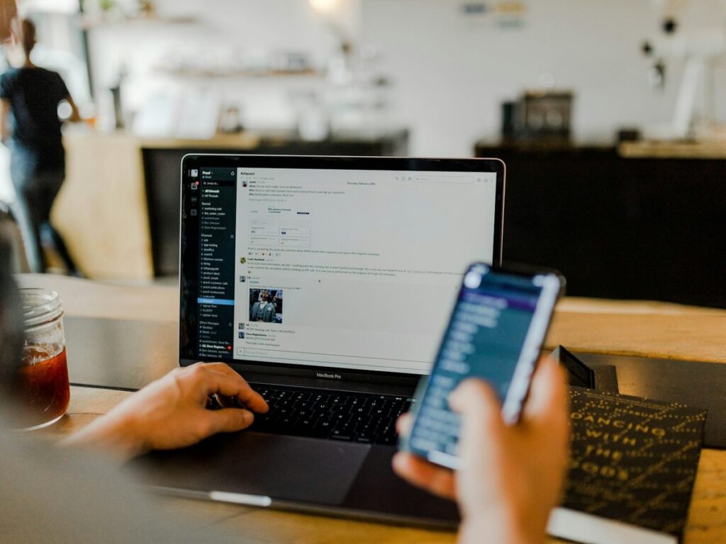 Checking a website on a laptop and phone