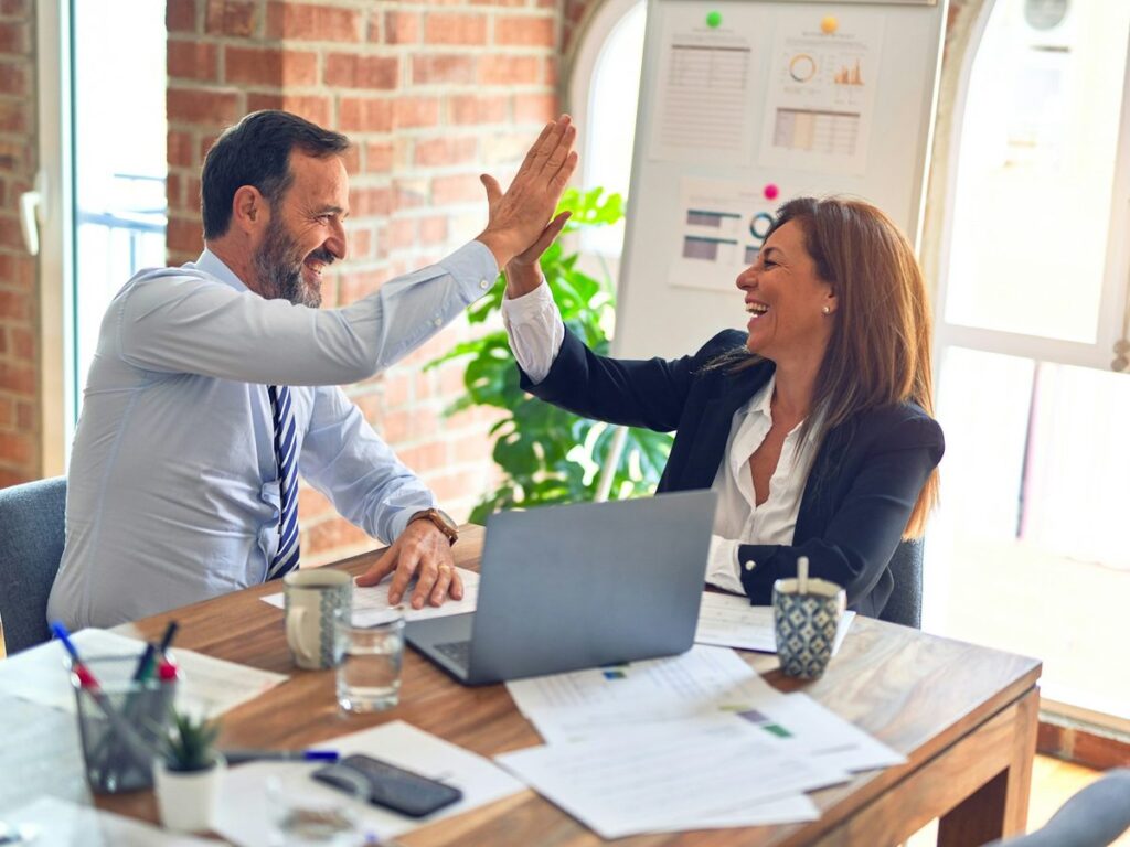Business owners celebrating a successful website launch