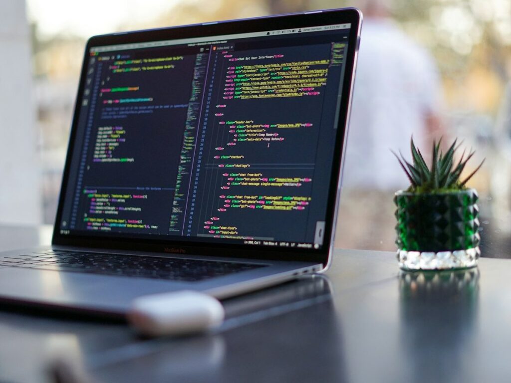 Laptop with code on a desk